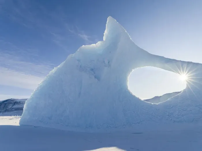 Framed Print : Iceberg frozen into the sea ice of the Uummannaq fjord system during winter Framed Print : Iceberg frozen into the sea ice of the Uummannaq fjord system during winter