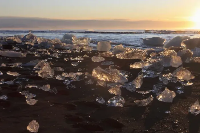 Framed Print : Iceberg nuggets shine like diamants at sunrise. Beach at Jokulsarlon, Iceland
