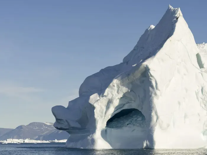 Framed Print : Iceberg in the Uummannaq Fjord System. Glaciated Nuussuaq peninsula in the background