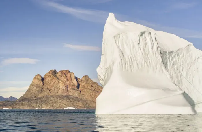 Framed Print : Iceberg in the Uummannaq Fjord System. Uummannaq Island in the background