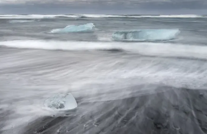 Framed Print : icebergs on black volcanic beach. Beach of the north atlantic near the glacial lagoon Joekulsarlon