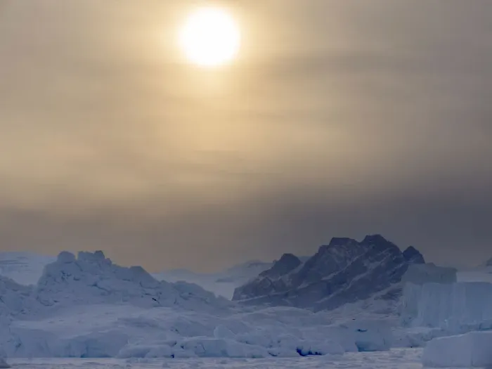 Framed Print : Icebergs frozen into the sea ice of the Uummannaq fjord system during winter