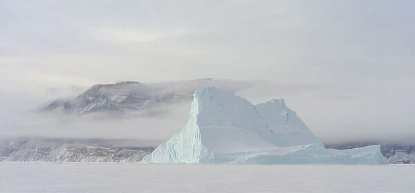 Icebergs in front of Storen Island, frozen into the sea ice of the Uummannaq fjord system