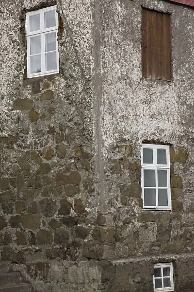 Iceland, Akureyri. Wall and window detail of an old stone house