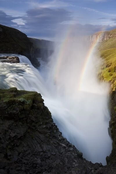 Iceland, Arnessysla County, Rainbow forms as Hvita River pours over Gullfoss waterfall