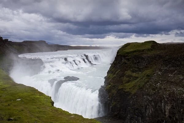 Iceland, Arnessysla, Hvita River pours over Gullfoss waterfall on summer evening