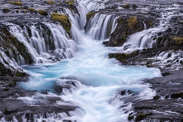 Iceland, Bruarfoss. Waterfalls flow into river