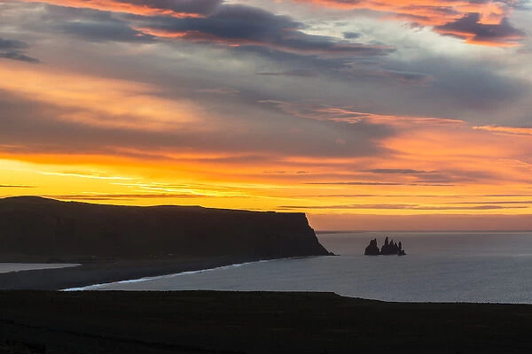 Iceland, Dyrholaey. Sunrise over ocean and land
