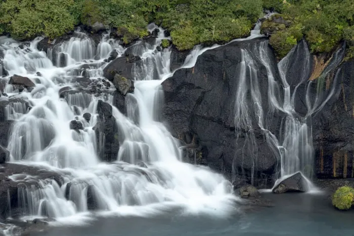 Framed Print : Iceland, Hraunfossar. Tiny cascades emerge from the lava to flow into the Hvita River