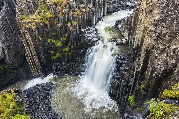 Iceland, Litlanesfoss. Waterfall and basalt columns