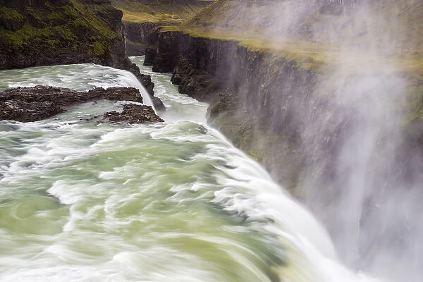 Iceland, Misty Gulfoss. Waterfall flowing into river