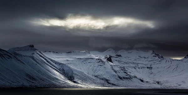 Iceland. Sunlight bursts through storm clouds