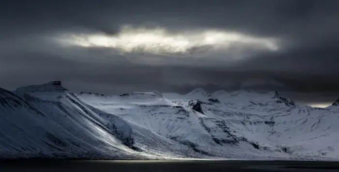Framed Print : Iceland. Sunlight bursts through storm clouds