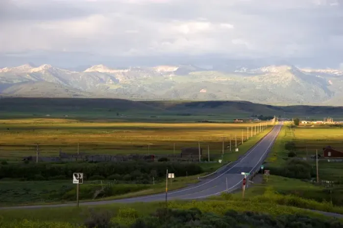 Framed Print : Idaho Highway 33 in Teton County with Teton Mountains near sunset looking east