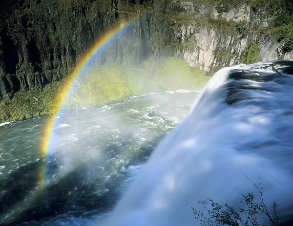 Idaho. USA. Rainbow in spray above Upper Mesa Falls on Henrys Fork of Snake River