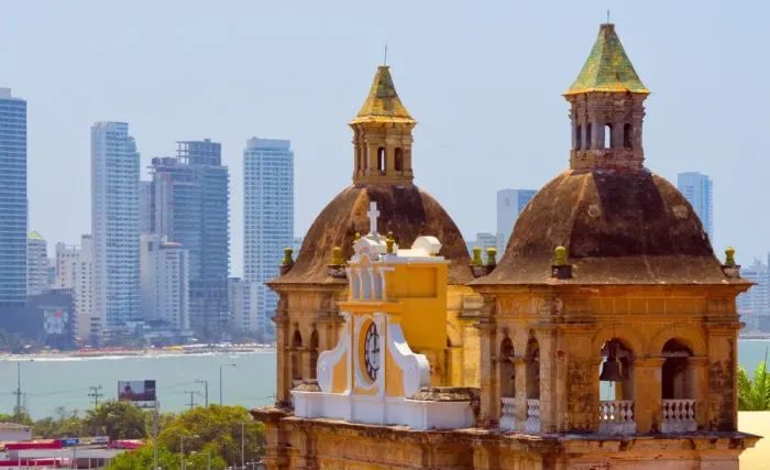 Framed Print : Iglesia de San Pedro Claver in the old town, high-rises of the new city in the background
