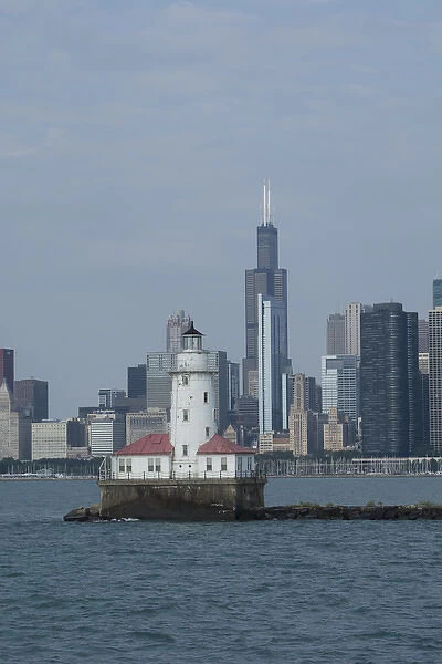 Illinois, Chicago, Lake Michigan. Historic Chicago Harbor Light with Chicago city skyline
