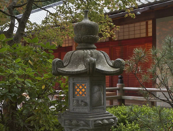 Illuminated stone lantern and pavillion in Portland Japanese Garden, Oregon