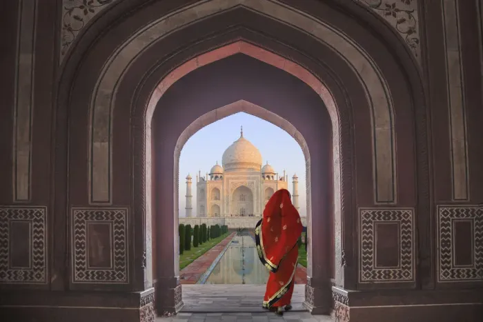 Framed Print : India, Agra, Taj Mahal. Composite of woman in archway facing mausoleum Framed Print : India, Agra, Taj Mahal. Composite of woman in archway facing mausoleum