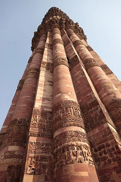India, Delhi. Carved stone minaret at Qutub Minar