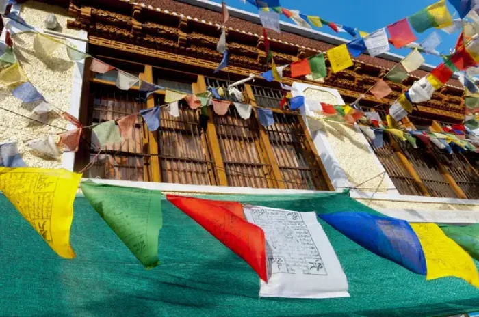 Framed Print : India, Jammu & Kashmir, Ladakh, prayer flags blowing in front of a traditional Ladakh