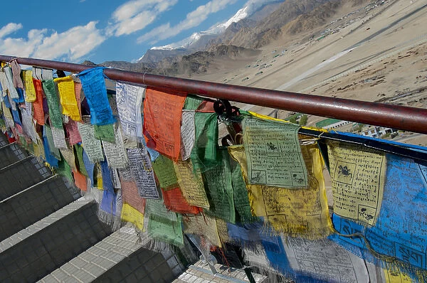 India, Jammu & Kashmir, Ladakh, Leh, capital of Ladakh prayer flags against a railing