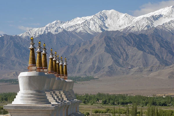 India, Jammu & Kashmir, Ladakh, white chortons with gold spires overlooking a valley