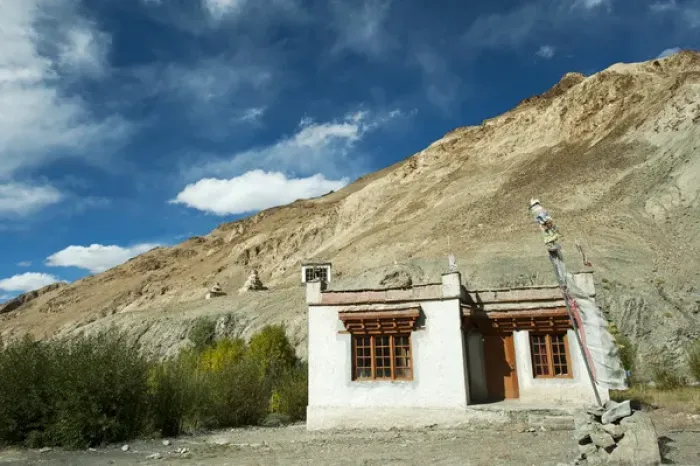 Framed Print : India, Ladakh, Markha Valley, old woman with ripples in front of typical ladakhi house Framed Print : India, Ladakh, Markha Valley, old woman with ripples in front of typical ladakhi house