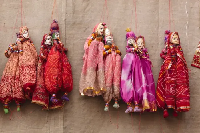 Framed Print : India, Rajasthan, Jhunjhunu District, Mandawa, Puppets hanging on wall