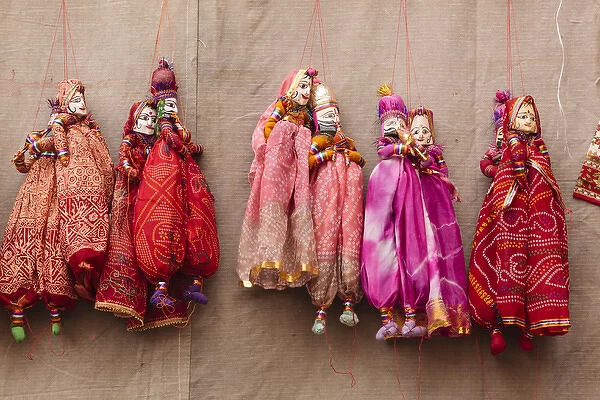 India, Rajasthan, Jhunjhunu District, Mandawa, Puppets hanging on wall