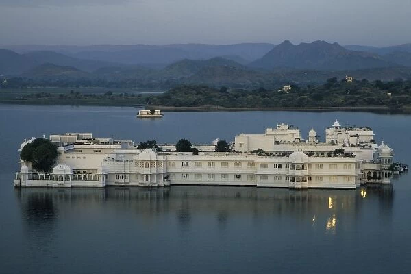 India, Udaipur. View of City Palace, now a museum, from Lake Palace Hotel on Pichola Lake