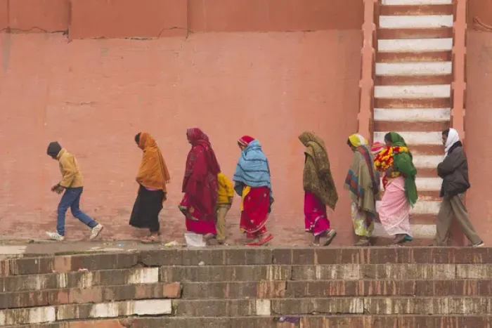 Framed Print : India, Uttar Pradesh, Varanasi. women and child walk along the Ganges river bulkhead