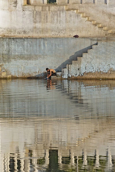 Indian man washing himself, Udaipur, India