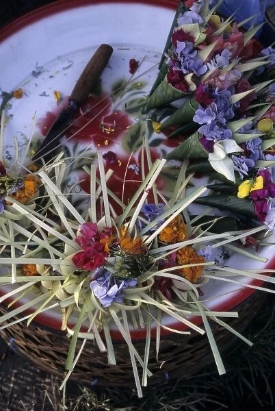 Indonesia, Bali. Flowers and palm ornaments are sold at Hindu temple ceremonies for