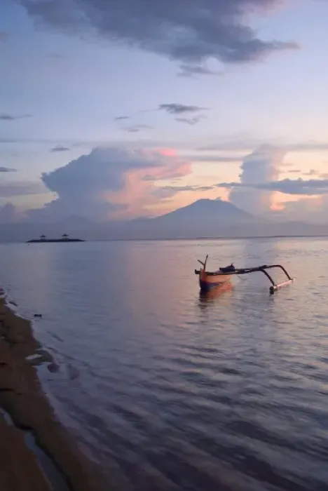 Framed Print : Indonesia, Bali. Sunrise on fishing boat and Sanur Beach with Mount Gunung Agung in distance