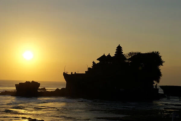 Indonesia, Bali, Tabanan. Tanah Lot temple at sunset