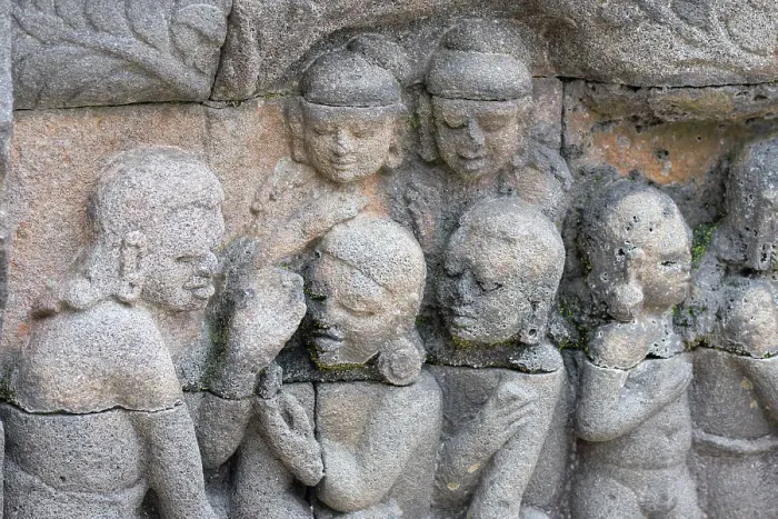 Framed Print : Indonesia, Java, Borobudur. Largest Buddhist monument in the world. UNESCO. Detail of carved stone figures in the hidden foot