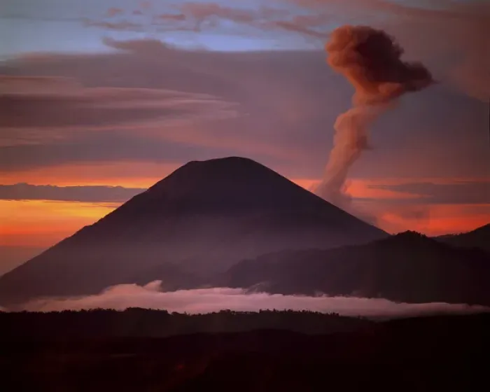 Framed Print : Indonesia. Mt. Semeru emits a plume of smoke moved by strong winds at sunrise. Credit as Framed Print : Indonesia. Mt. Semeru emits a plume of smoke moved by strong winds at sunrise. Credit as