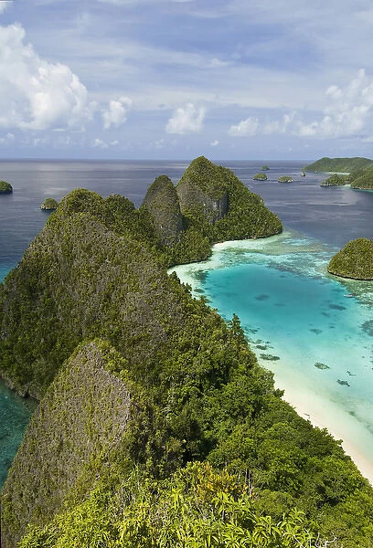 Indonesia, New Guinea Island, Raja Ampat. Scenic of islands covered with vegetation