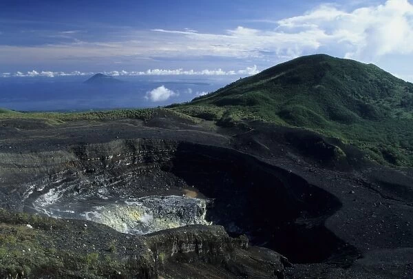 Indonesia, Sulawesi. Crater of Gunung Lokon volcano near Manado, Manado Tua island in distance