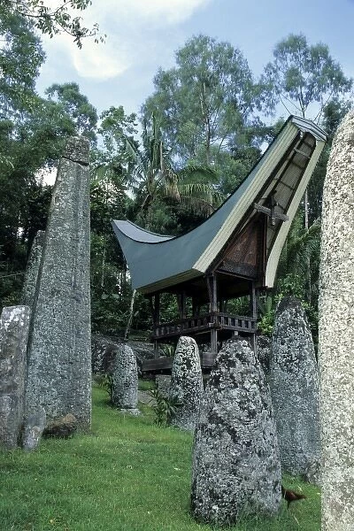 Indonesia, Sulawesi, Tana Toraja region. Christian tomb in boulder, adorned with