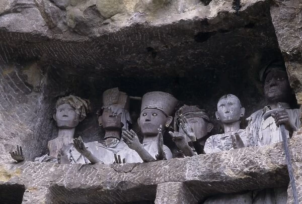 Indonesia, Sulawesi, Tana Toraja region. Tau tau, effigies of departed nobles, guard