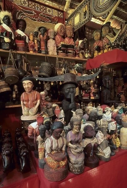 Indonesia, Sulawesi, Tana Toraja Region. Carved Tau Tau (effigies) in shop
