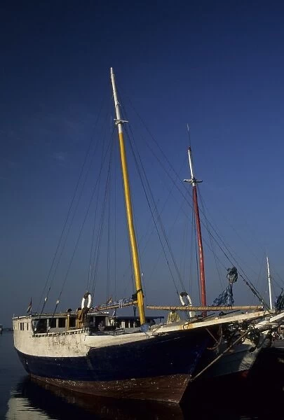 Indonesia, Sulawesi, Ujung Pandang. Bugis pinisi schooners docked at Paotere Harbor