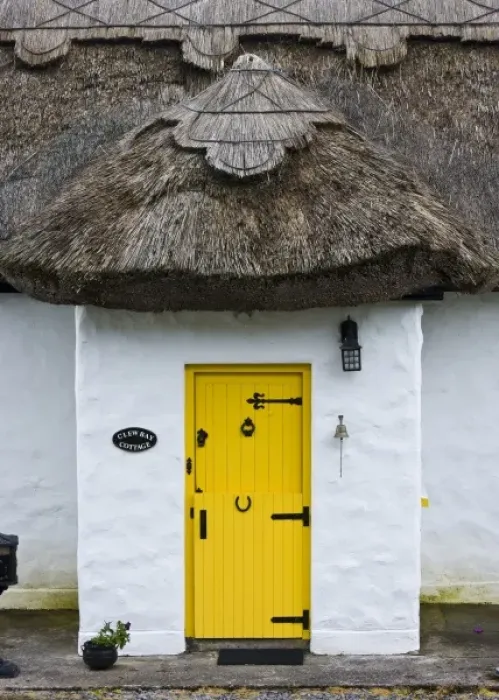 Framed Print : Ireland, Achill Island. Yellow doorway on a thatch roof cottage Framed Print : Ireland, Achill Island. Yellow doorway on a thatch roof cottage