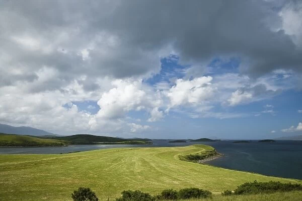 Ireland, County Mayo. A grazing pasture reaches down to the waters of Clew Bay