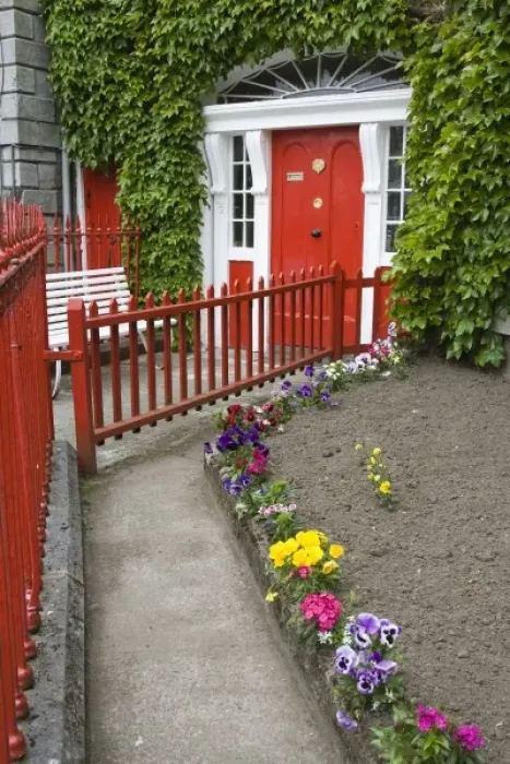Framed Print : Ireland, County Mayo, Westport. Walkway leading to an ivy-covered house with a red door Framed Print : Ireland, County Mayo, Westport. Walkway leading to an ivy-covered house with a red door