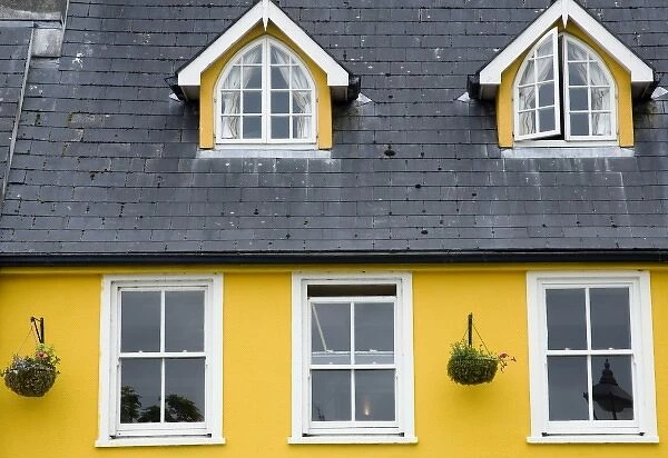 Ireland, County Mayo, Westport. Cheerful yellow house