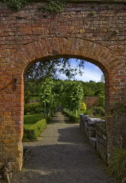 Ireland, the Dromoland Castle Walled Garden path through a brick archway