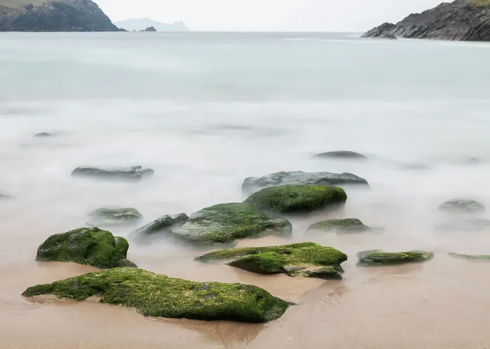 Framed Print : Ireland, Dunquin, Kinnard Beach. Abstract of wave froth and rocks on shore